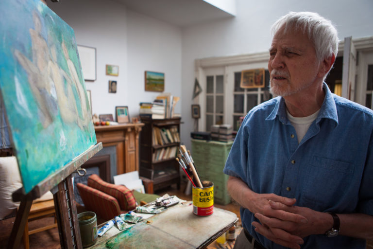 Lennart Anderson in his studio looking at his painting "Three Graces"