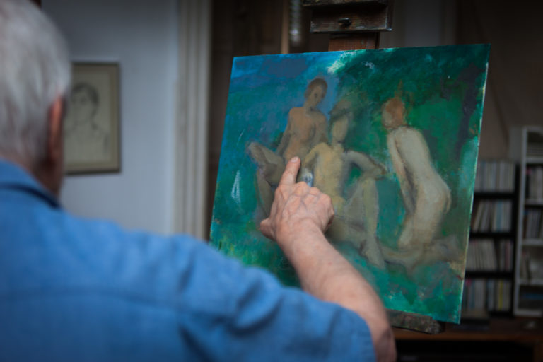 Lennart Anderson in his studio pointing at his painting "Three Graces"