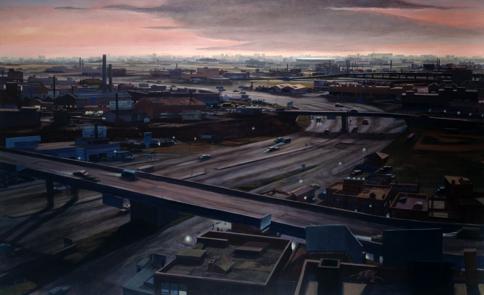 The sun is rising or setting above the skyline of a vast city, which is visible in the distance. We look down on the outskirts: a highway with multiple lanes in both directions curves serpentine-like from the bottom left-hand side of the picture to the right, then around toward the upper left-hand distance. It is crossed by two overpasses. On either side of the highway are industrial buildings, rail yards, bill boards, smoke stacks. There is a surreal, desolate air to the scene.Aside from the few cars, there is no sense of life or movement. The light is a lurid purple.