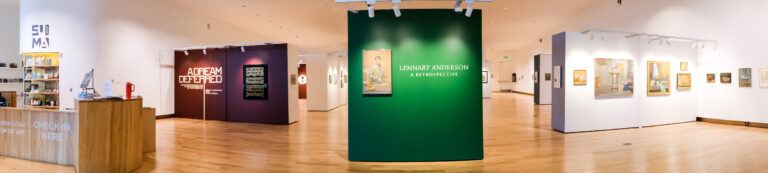 Front display wall of the Lennart Anderson exhibition and broader shot of the gallery. A green wall with a painting of a man and exhibition title.